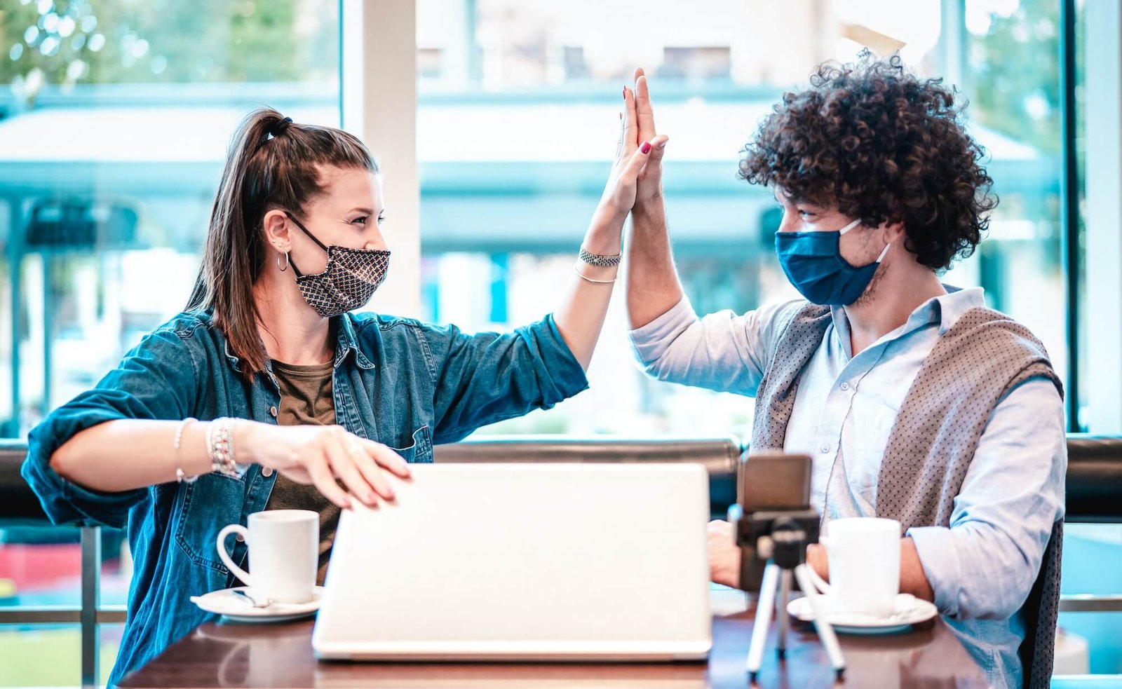 young-milenial-influencers-at-coworking-space-with-facemask.jpg